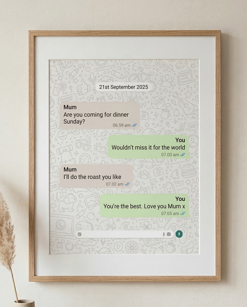 Framed text message print on a wall with decorative elements.